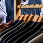 row of suits on display at a custom suit shop in San Francisco