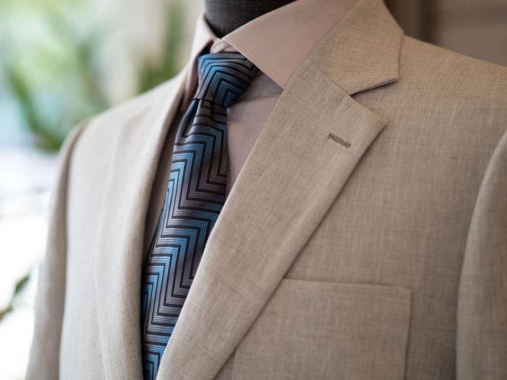 Close up of bespoke suit tailor and detail